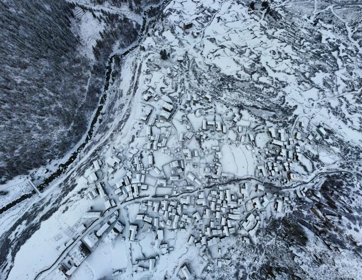 aerial view of houses and buildings in snow