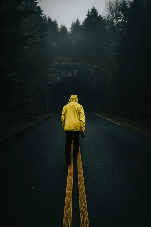 a person standing in the middle of a street