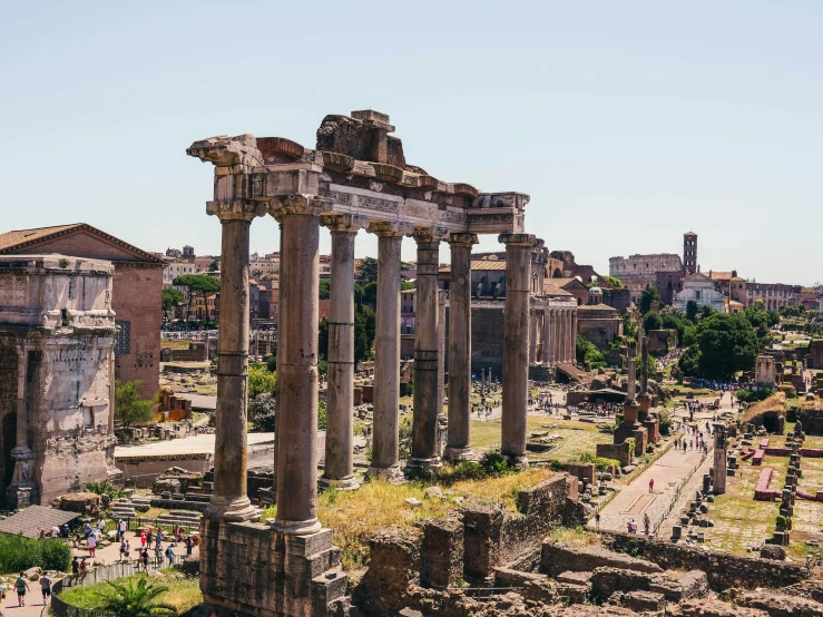 an old roman city with ancient ruins in front