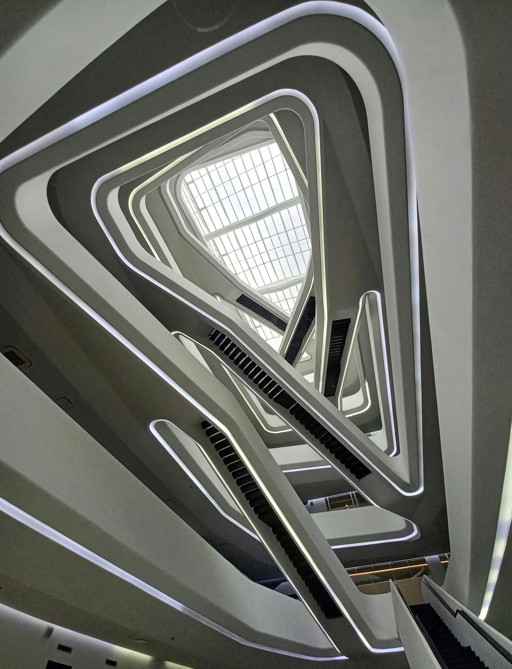 an open space with metal railings and an unusual roof