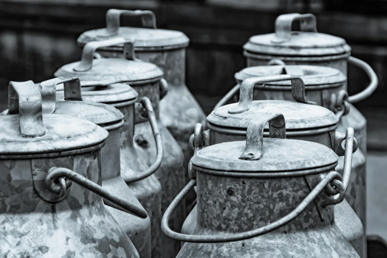 several steel tanks with nozzles sitting on top of each other