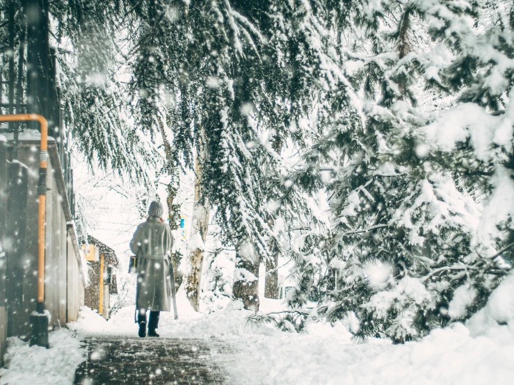 a person that is standing in the snow