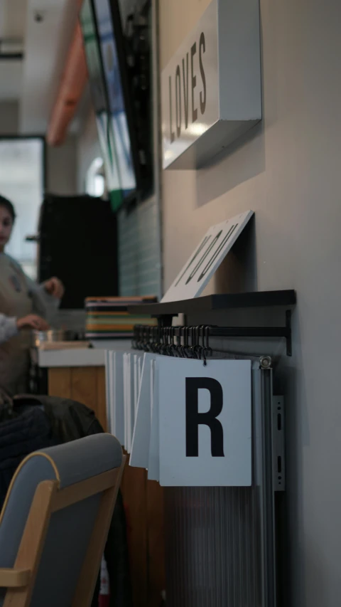 a man sits in front of a desk with his laptop