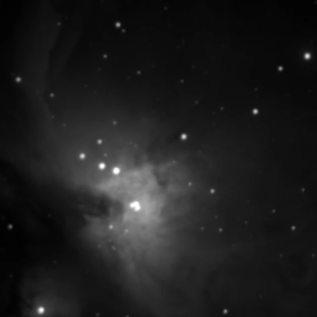 a black and white image of the heart of a star cluster