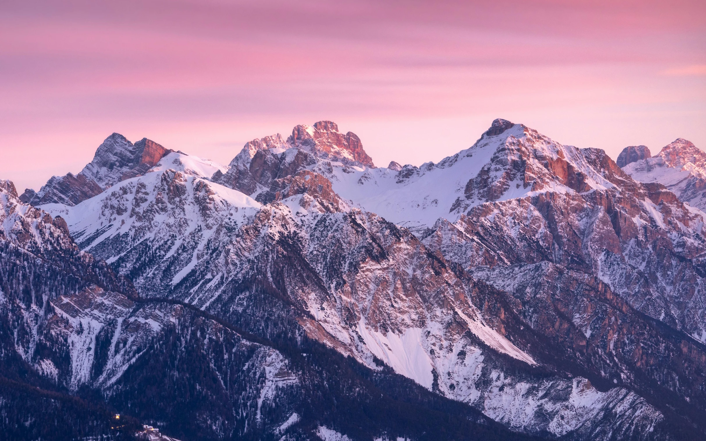 an image of some snow covered mountains that are very pink and yellow