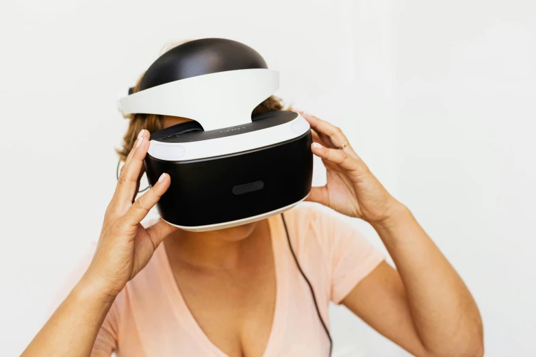 a woman is wearing a virtual - reality headset