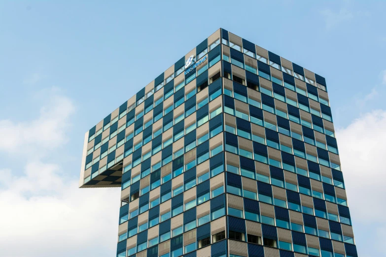 this tall building is against a clear blue sky