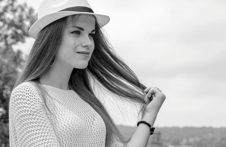 a woman in a white hat and shirt