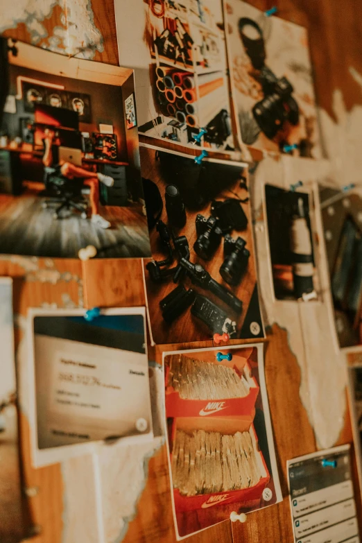 a wooden wall covered in pictures of various things