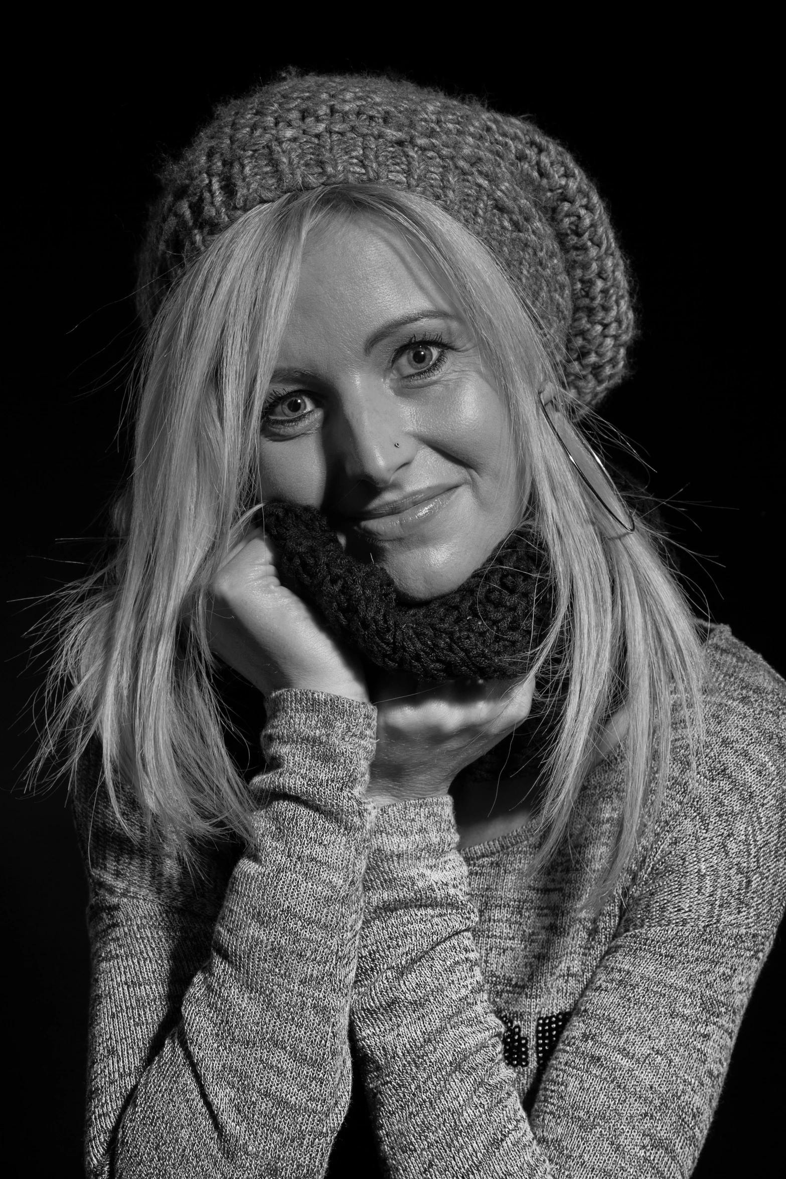 black and white pograph of a woman wearing a hat