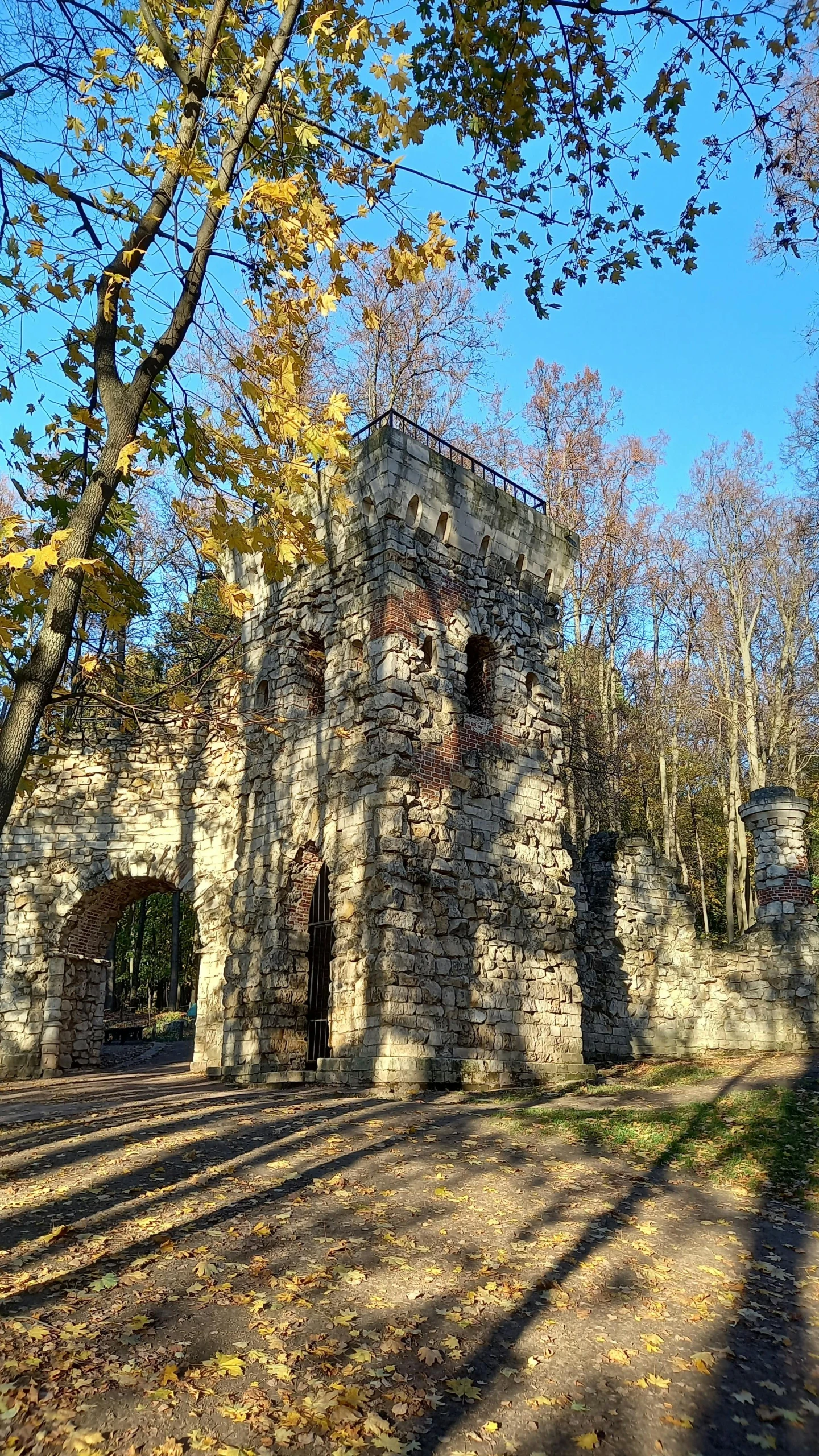 an old brick building is surrounded by trees