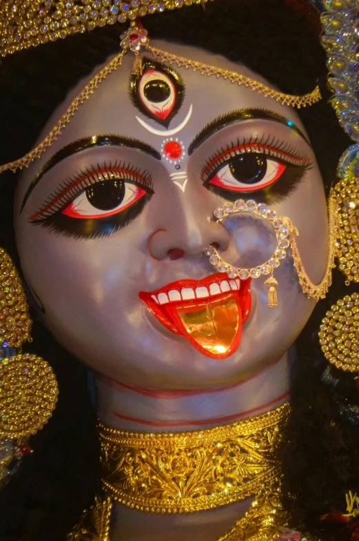 a close up of a person with a face makeup and bright eyes