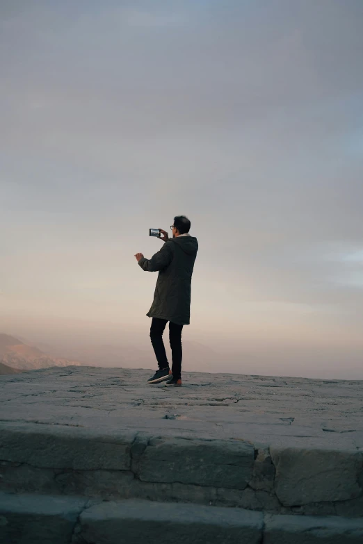 a person with a camera standing in a field