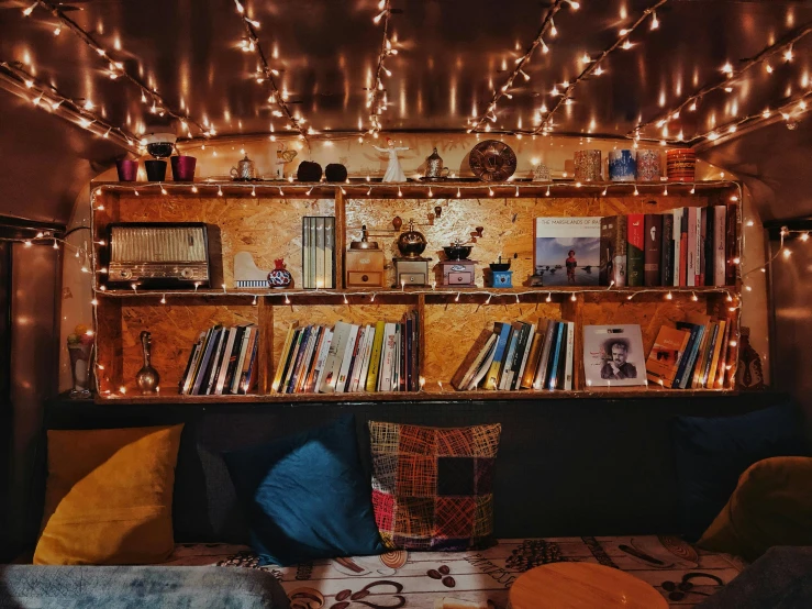 a living room filled with furniture and lots of lights