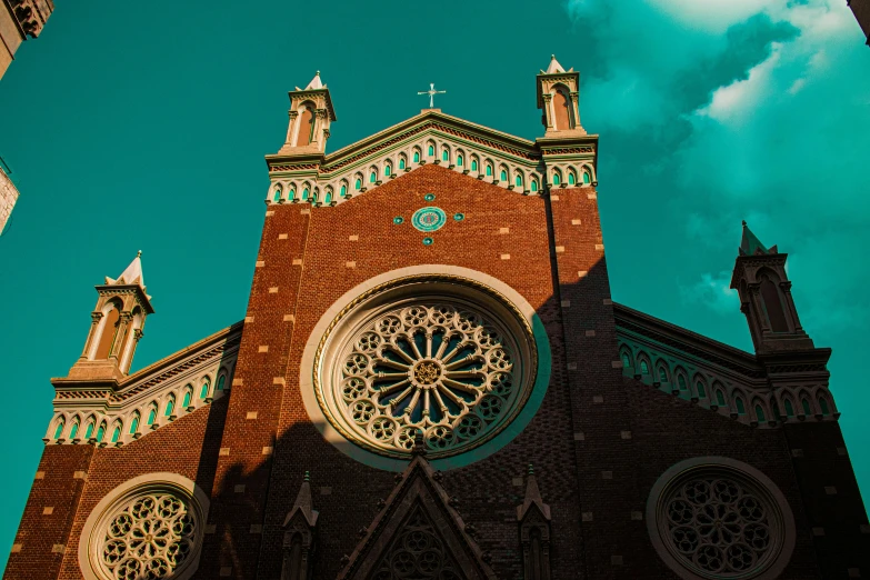 a gothic building is shown against a blue sky