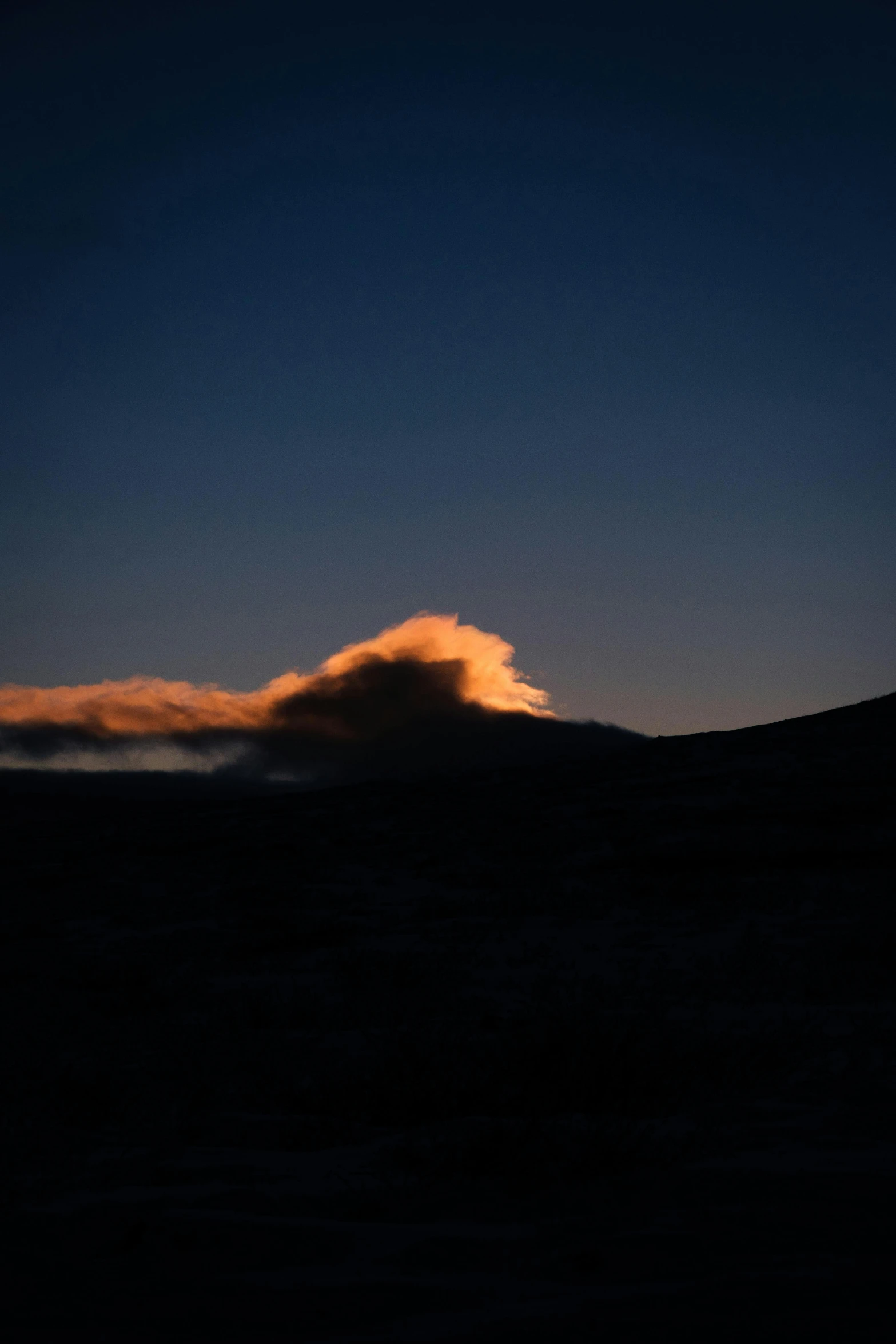 the sun shining through the clouds and creating a big wave