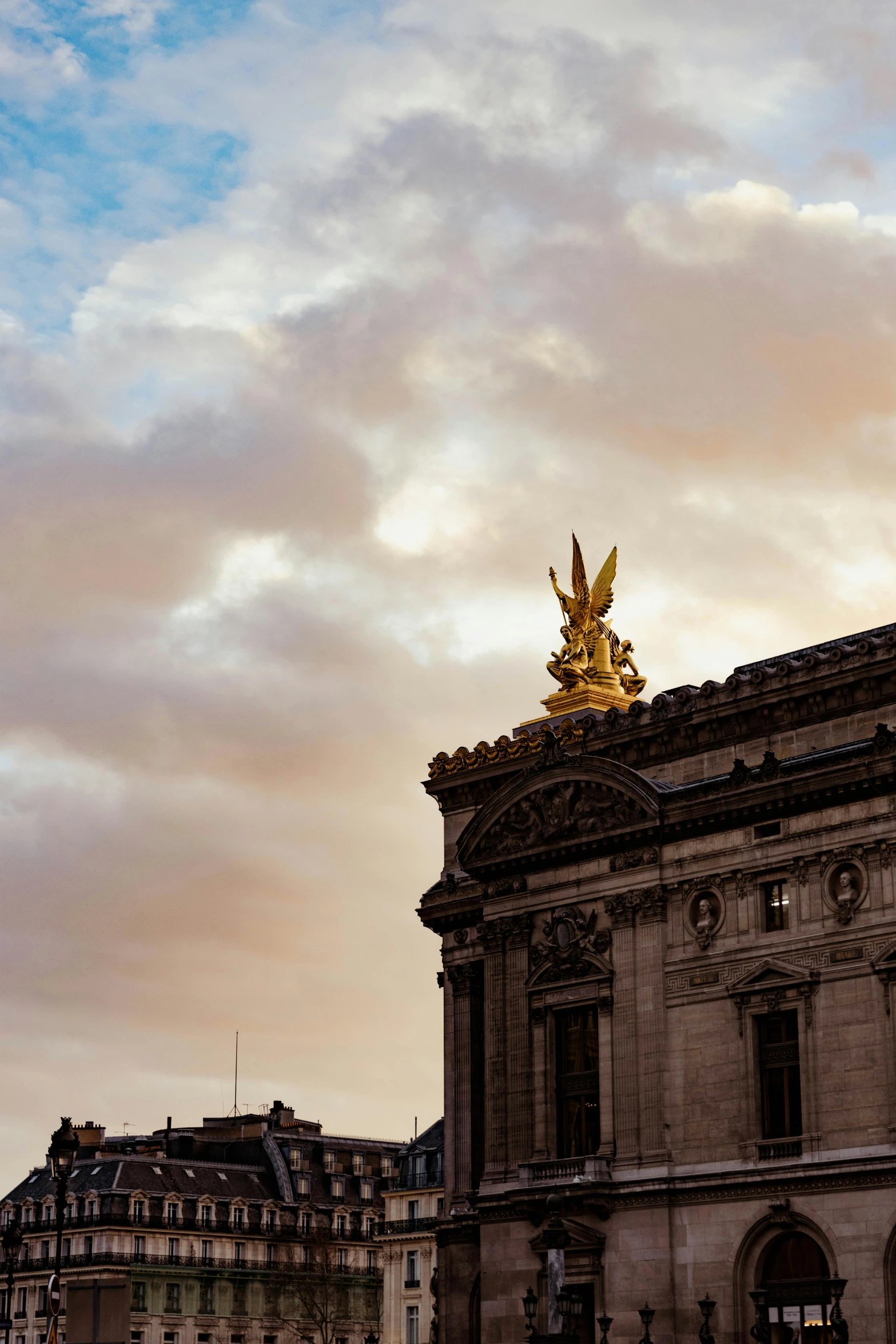 there is a golden angel statue on top of this building