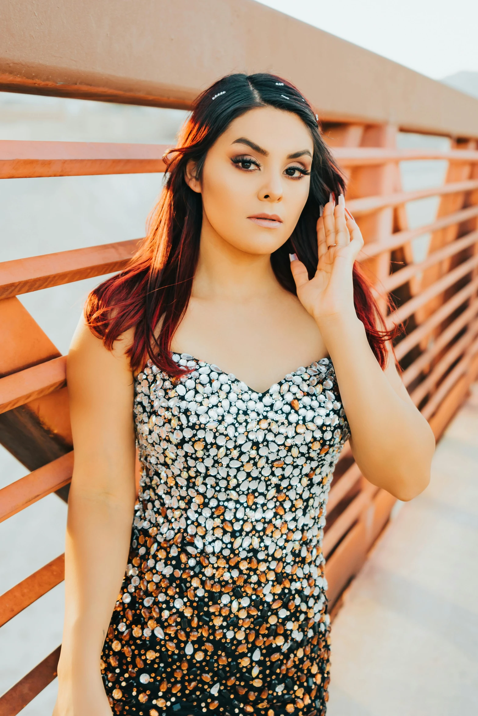 young beautiful woman posing for po with hand on cheek