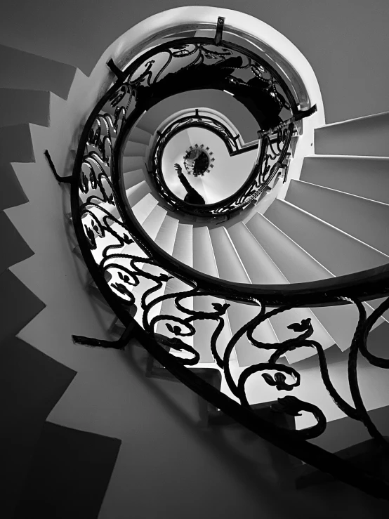 a black and white po of a spiral stair