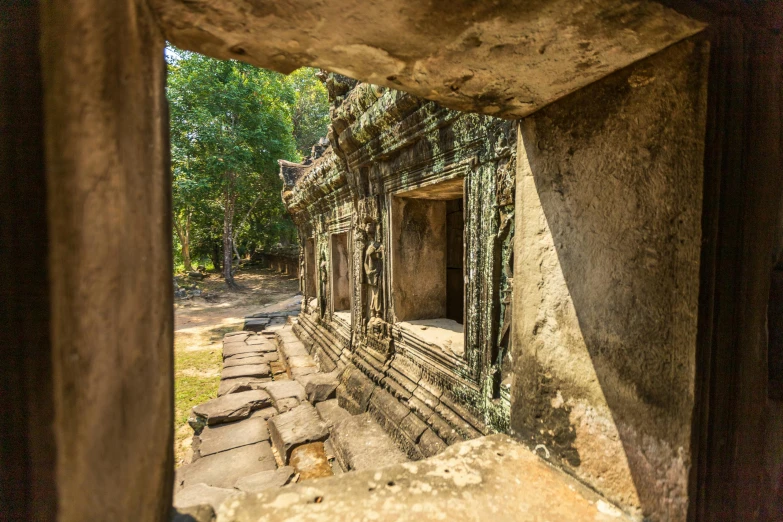 view through door way showing stone wall in park area