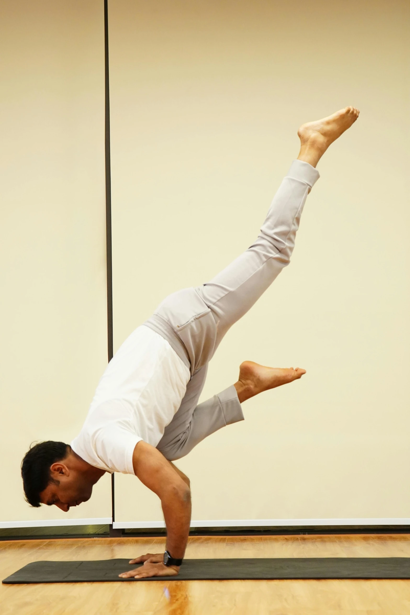 a man does a yoga pose in a yoga position