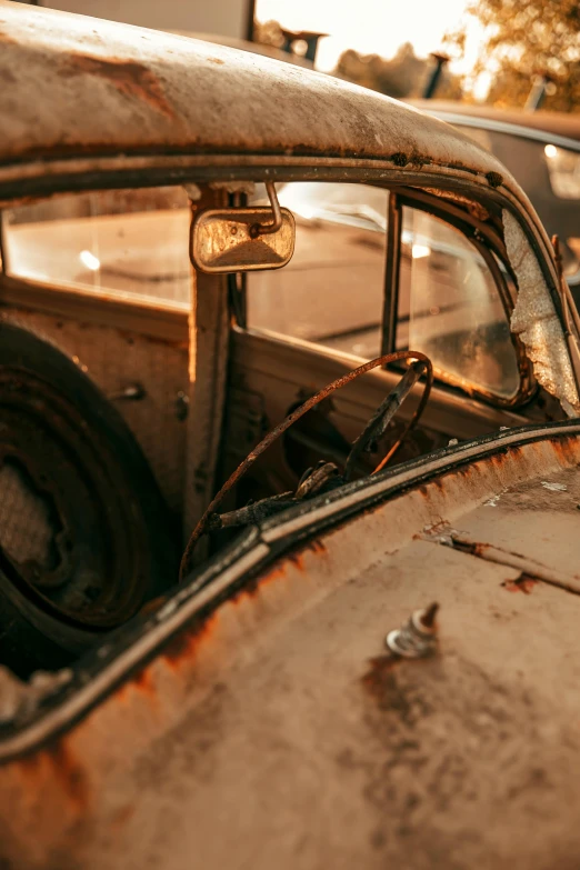 old dirty antique car with rust and rusted up windows