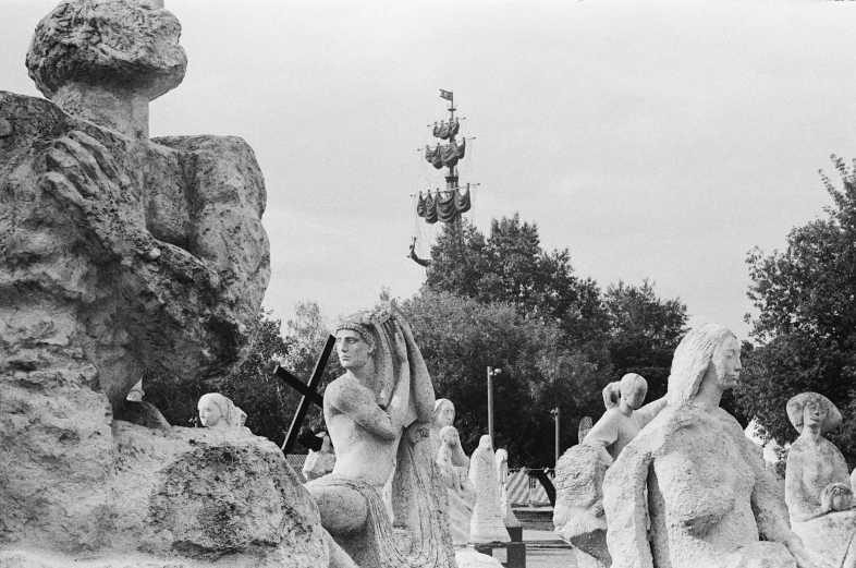 black and white image of statues at park