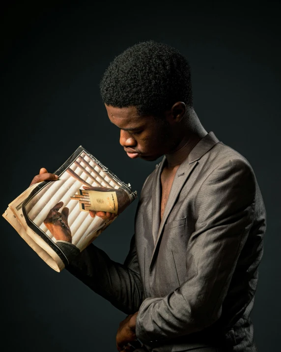 a man with his hands in his face holding a tray