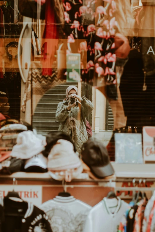 the woman takes her picture in front of a mirror