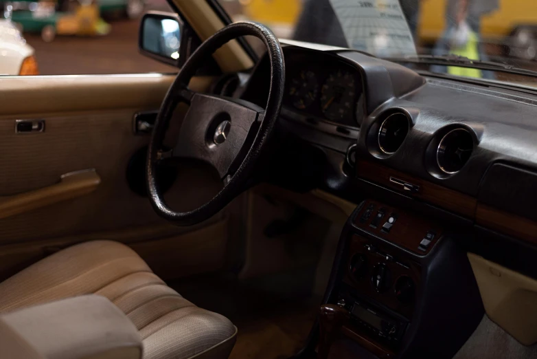 an interior view of a car with leather and beige trim