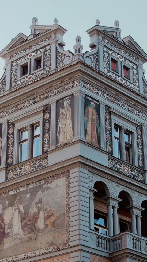 a building with a clock tower, painted in various styles and colors