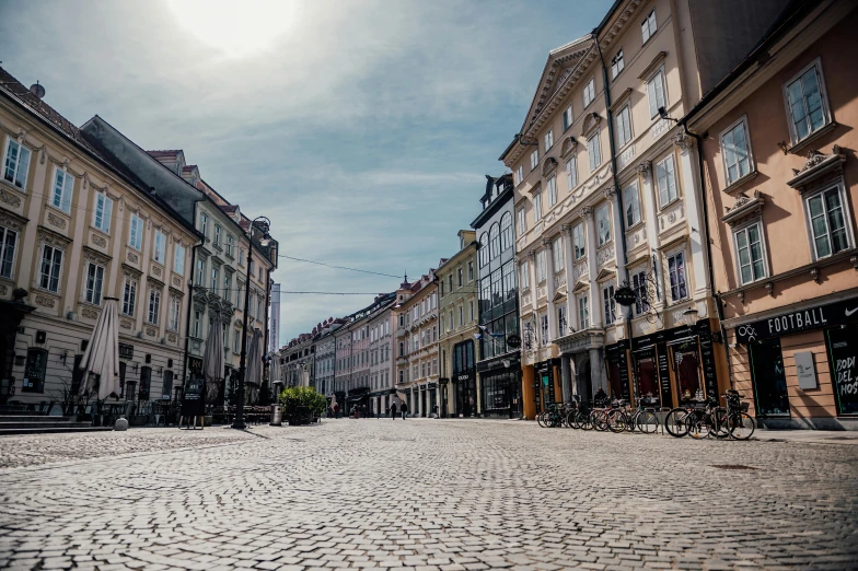 the cobblestone road through the streets has many windows