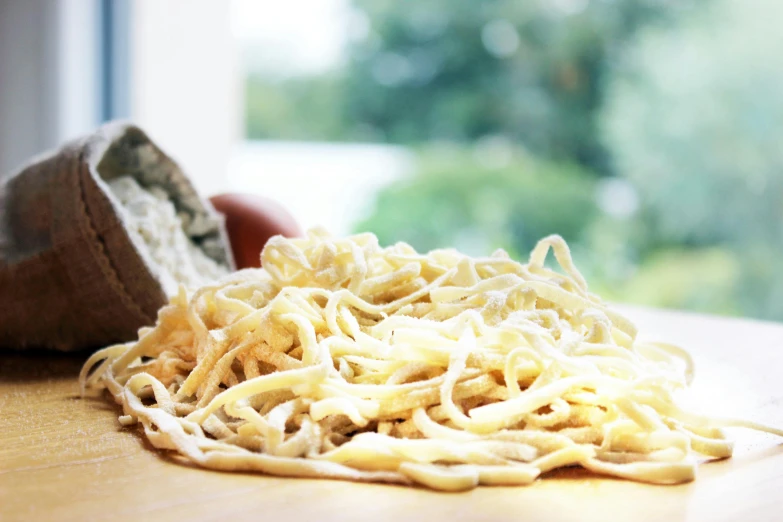 pasta and a bread bag on the table