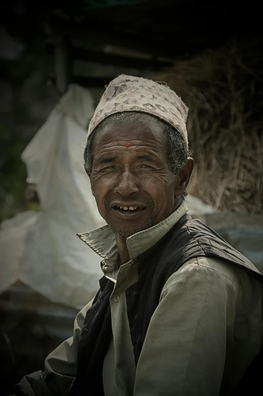 a close up of a person wearing a headscarf