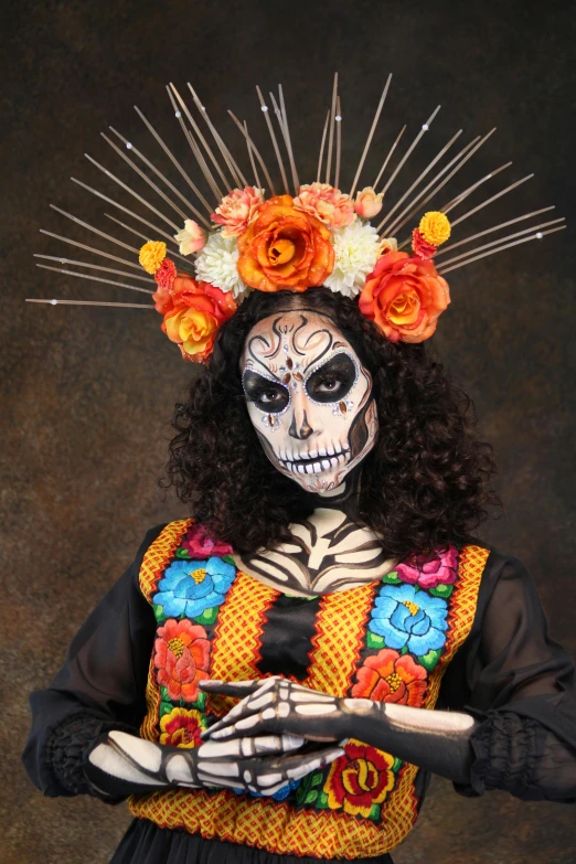 a skeleton wearing mexican costumes poses for a picture