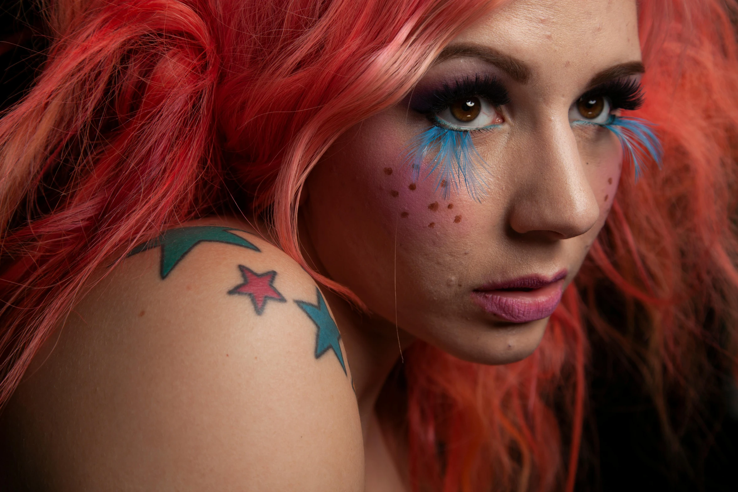 a girl with pink hair is decorated with stars