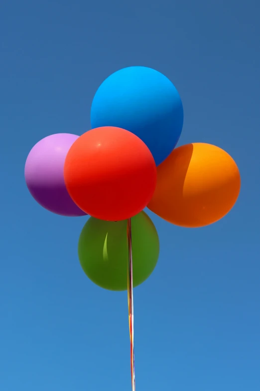 a group of balloons that are in the air
