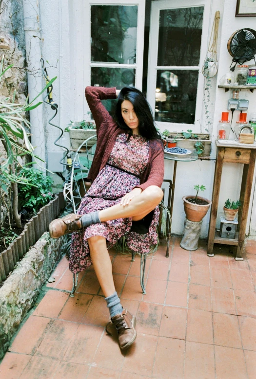 a woman sitting on the porch in her house