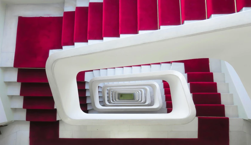 white and red staircase with large tiles in center