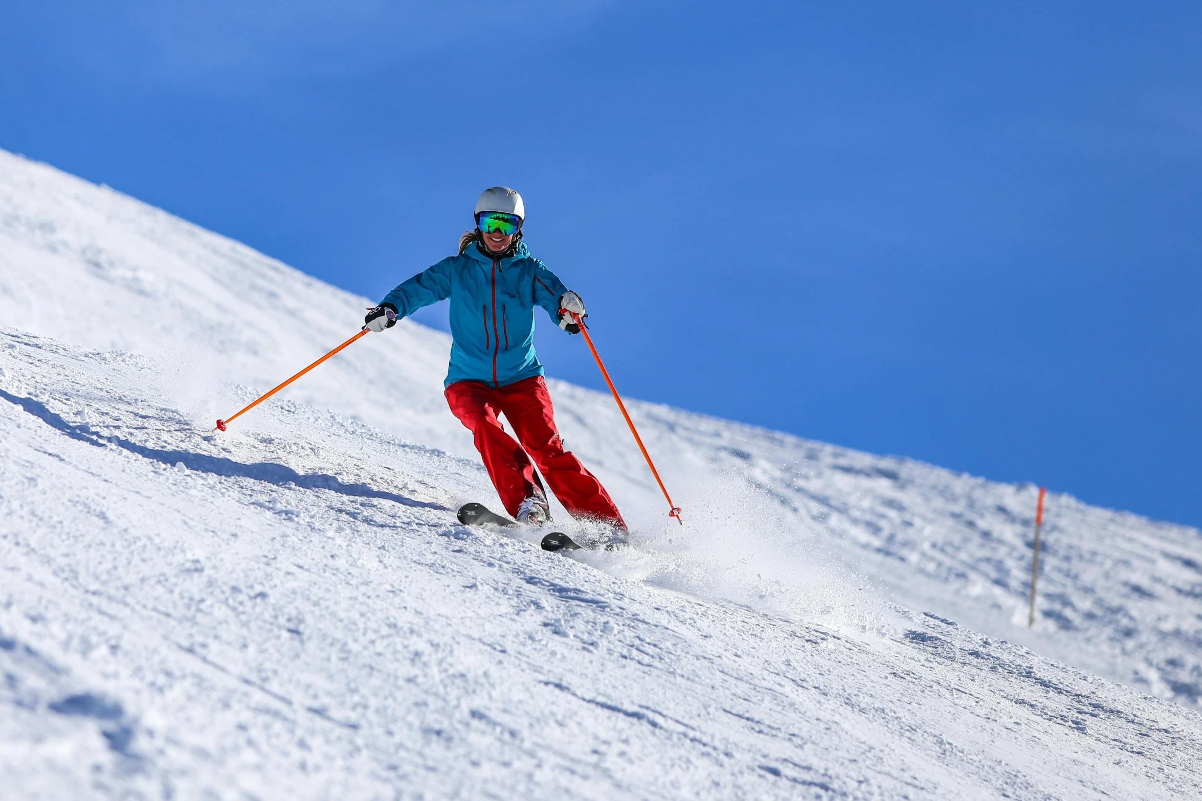 a skier moves through the snow in his ski gear