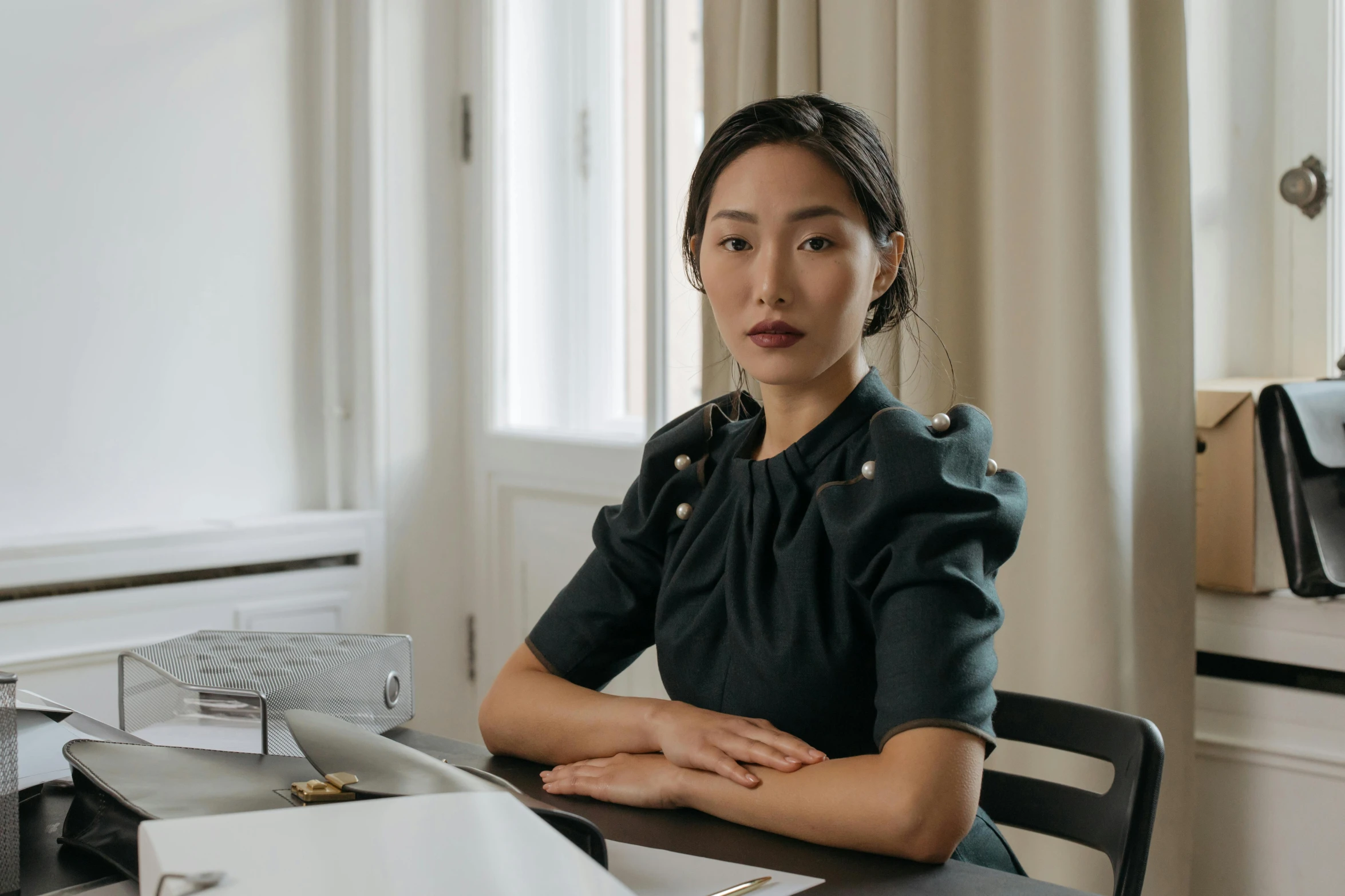 a woman is sitting at the table by herself