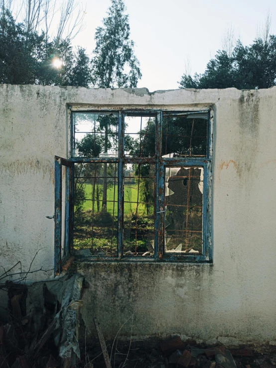 an old window in a dilapidated building