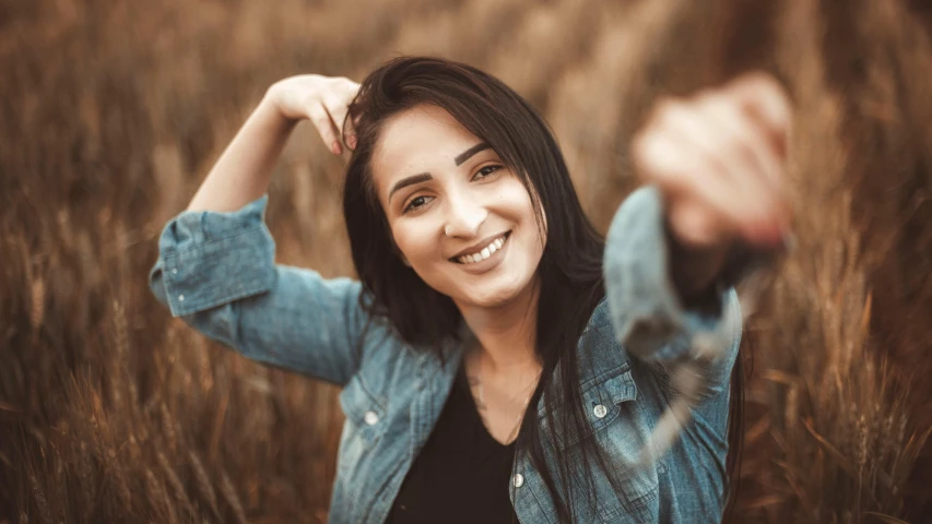 an image of a smiling woman posing for a po