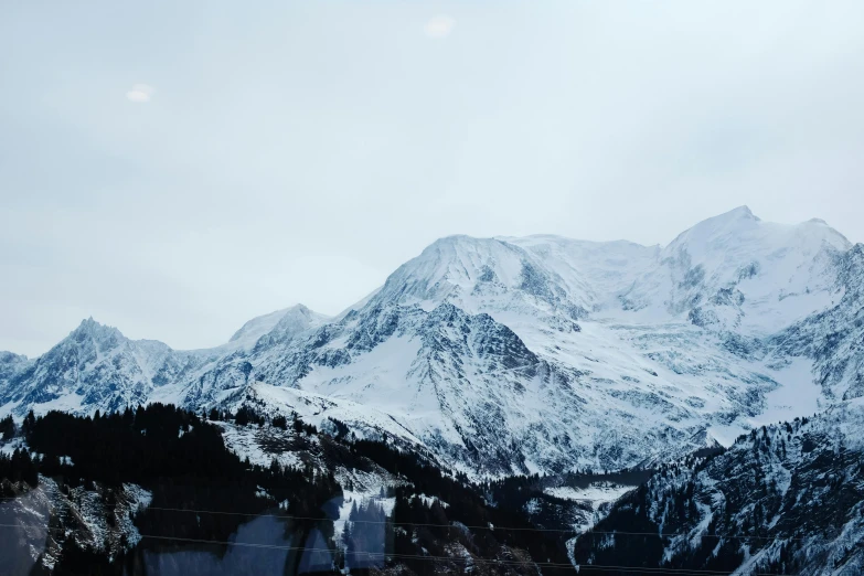 the view from the top of a snowy mountain