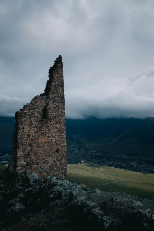 an abandoned building in the middle of a field