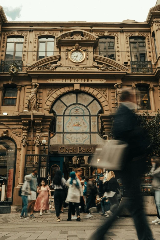 a crowd of people in front of a building