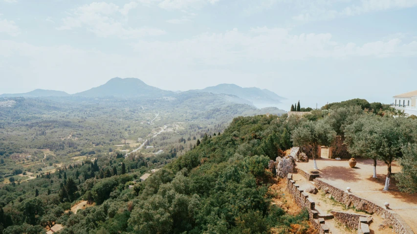 the landscape is stunningly green with mountains in the background