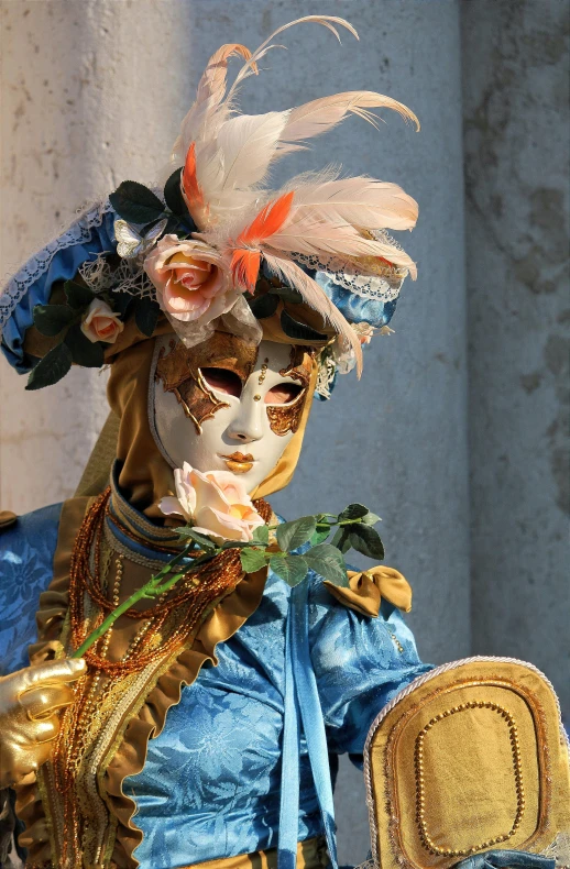 a person dressed in some kind of mask with flowers