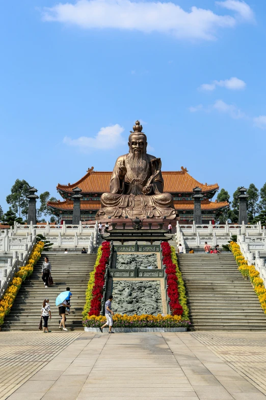 the buddha statue is in the middle of the steps