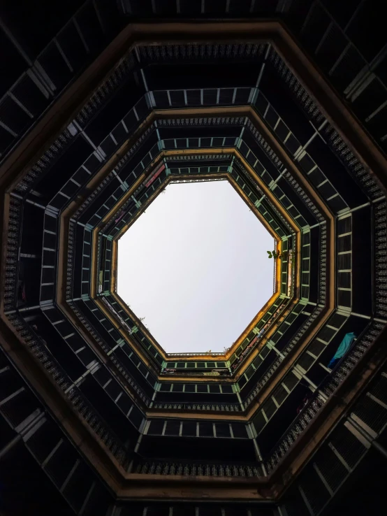 a view from the bottom looking up to the ceiling in a book structure